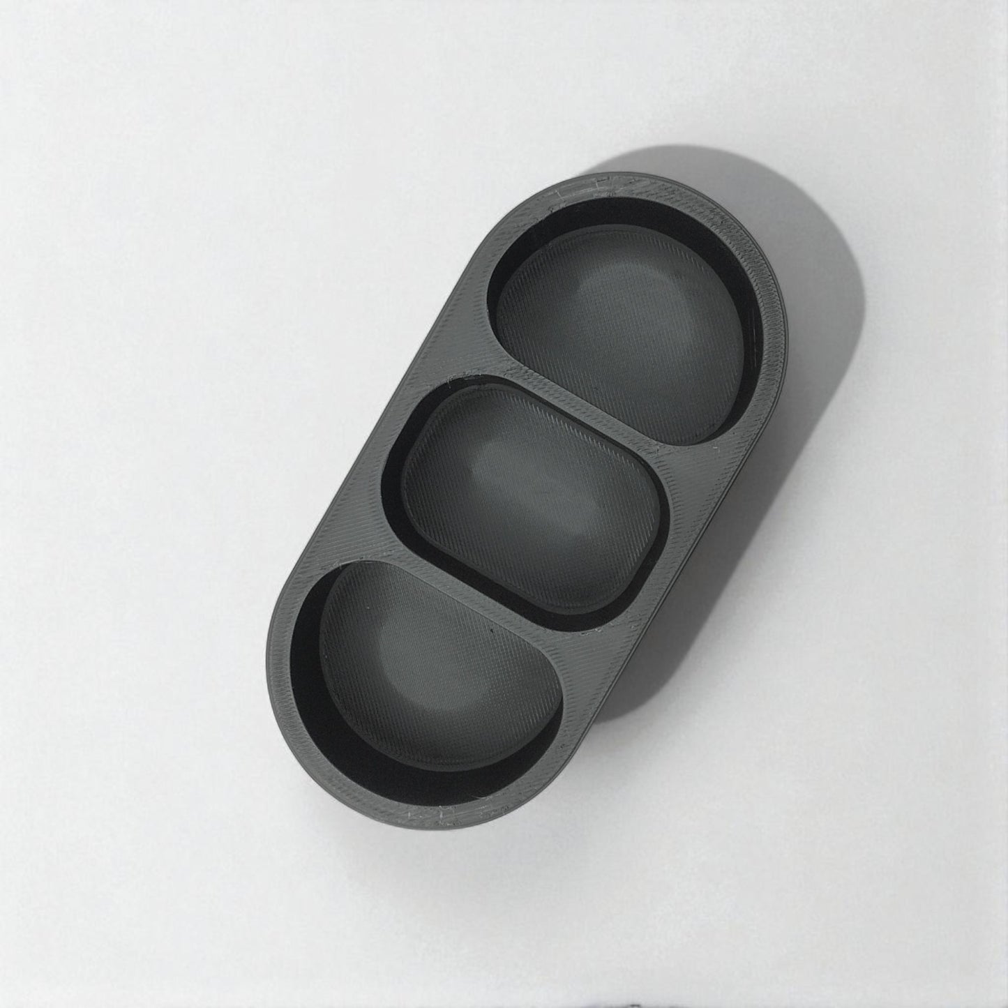 round remote holder a sleek remote holder with three compartments, perfect for organizing remotes, small accessories, or gadgets while adding a modern touch to your living space
