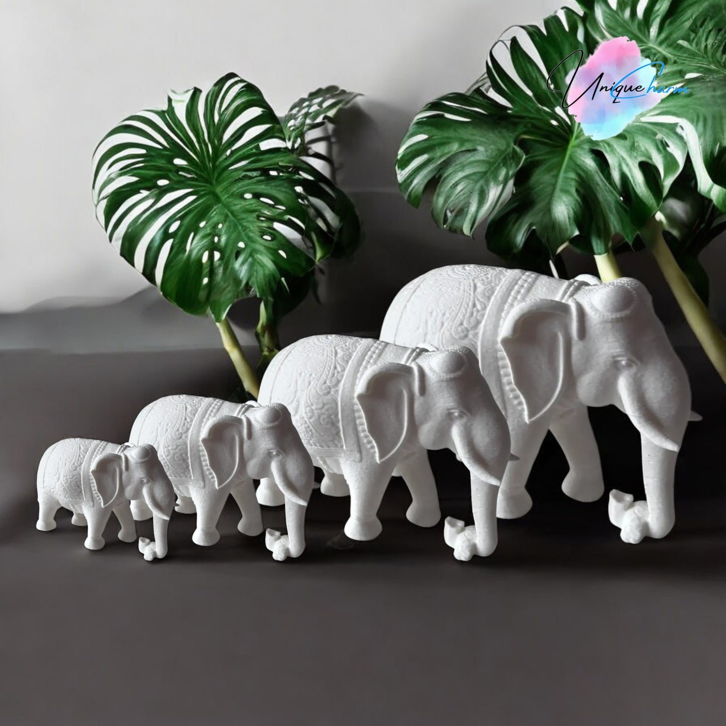 set of 4 indian elephant figurines in varying sizes, 3d-printed with intricate details. modern and elegant home decor piece, perfect for shelves, desks, and gifting. symbolizing wisdom, luck, and prosperity, these minimalist elephant sculptures add a spiritual and stylish touch to any space.