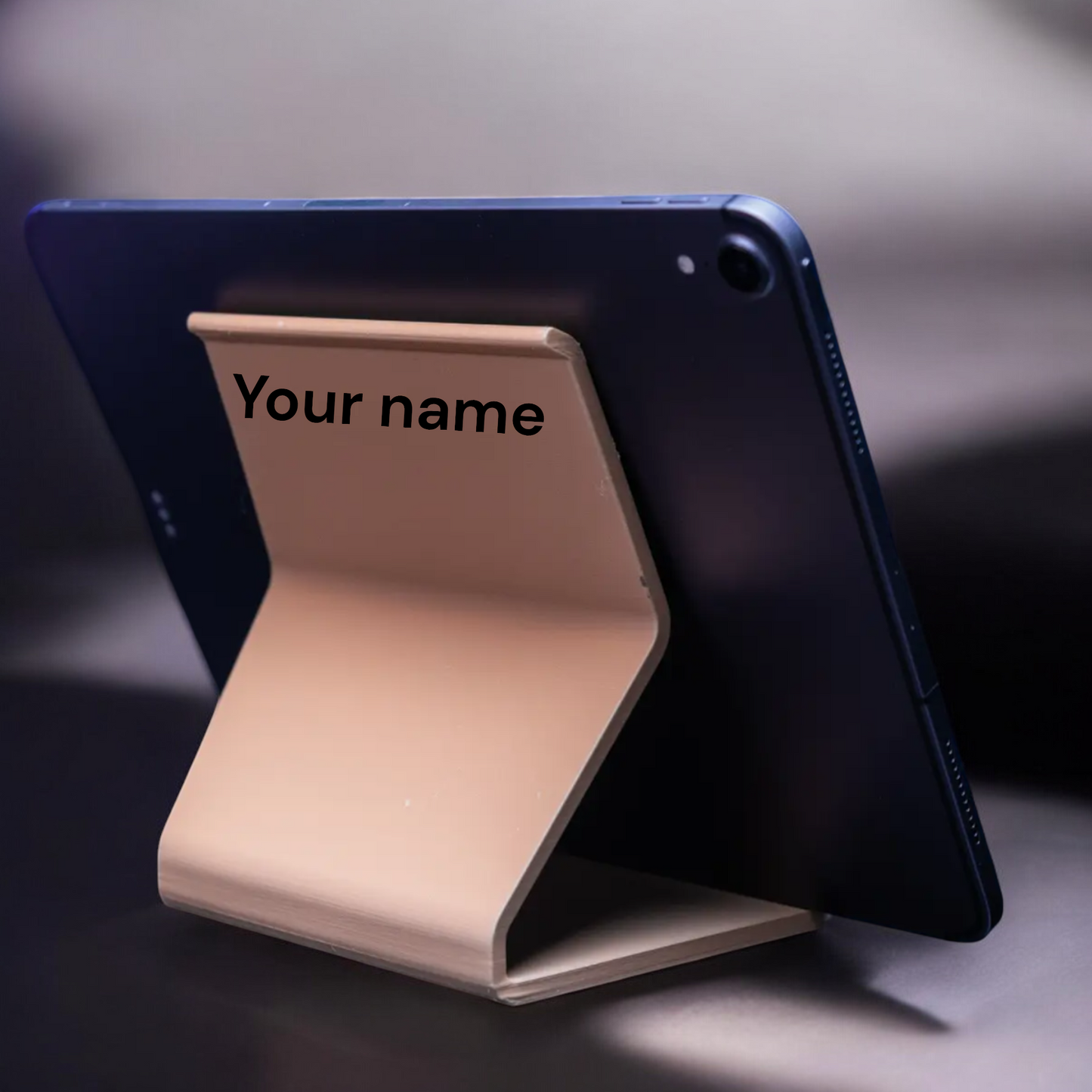 customizable modern phone and tablet holder, personalized with your name or message, perfect for hands-free use at home, work, or on the go.