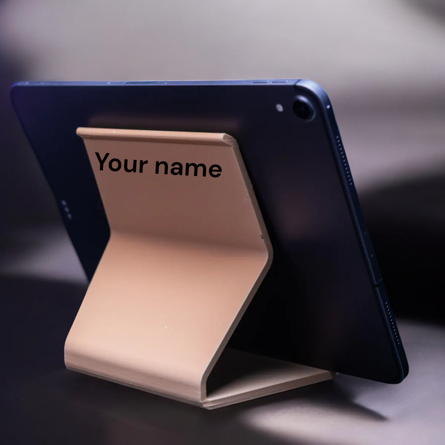 Customizable modern phone and tablet holder, personalized with your name or message, perfect for hands-free use at home, work, or on the go.