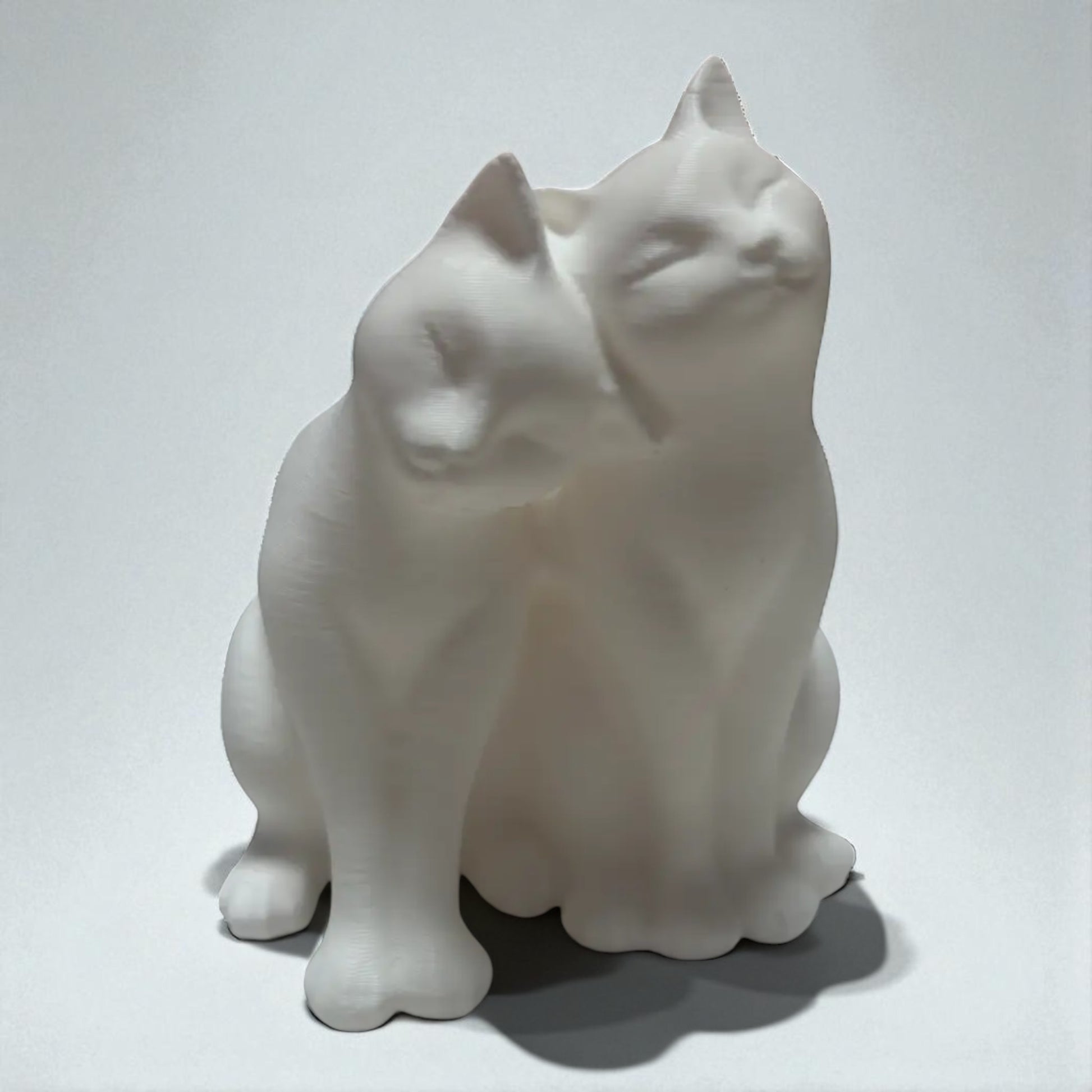 A heartwarming statue of two cats, symbolizing love and companionship between animals. Perfect for cat lovers and a charming addition to any home decor.