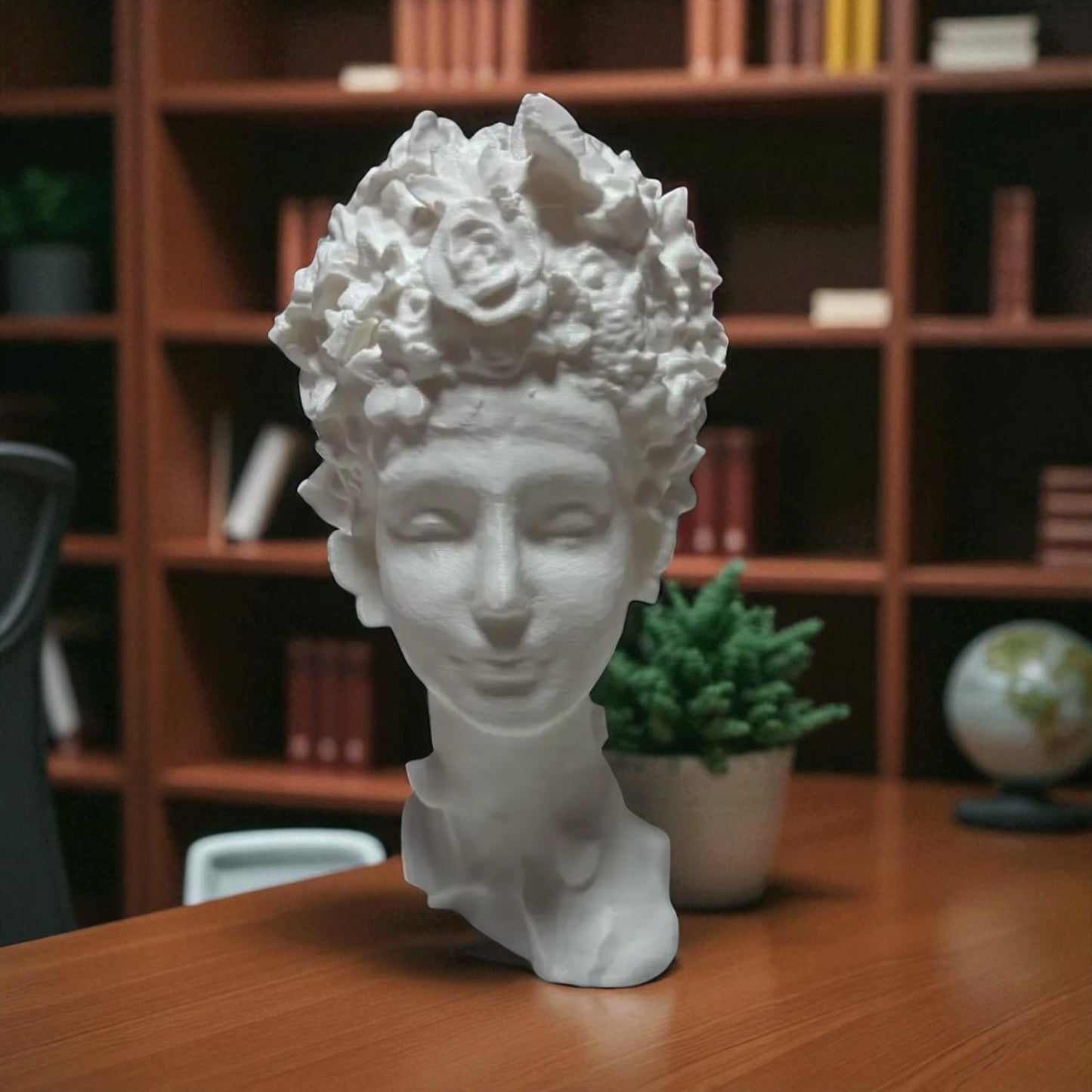 stunning 'flora grace sculpture,' a statue of an egyptian-inspired lady resembling aphrodite, adorned with intricate flowers and butterflies in her hair. this elegant piece exudes beauty and sophistication, making it a timeless decorative accent.