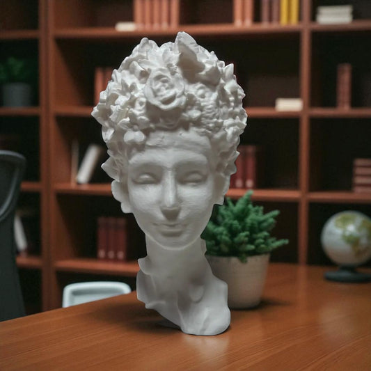 Stunning 'Flora Grace Sculpture,' a statue of an Egyptian-inspired lady resembling Aphrodite, adorned with intricate flowers and butterflies in her hair. This elegant piece exudes beauty and sophistication, making it a timeless decorative accent.