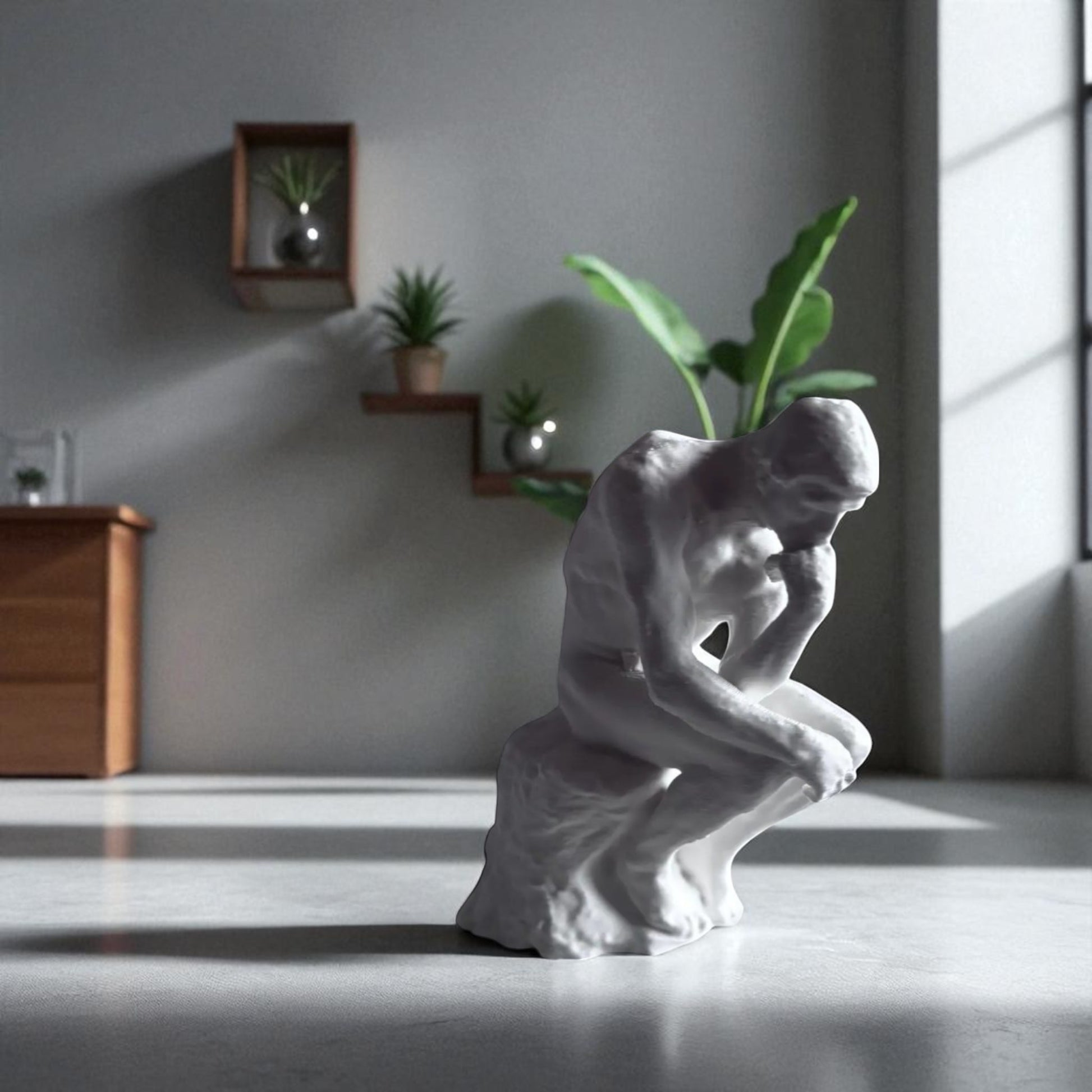 A statue titled 'Contemplative Reflection' depicting a man seated in a thoughtful, meditative pose. This sculpture embodies the essence of mindfulness, yoga, and inner peace, symbolizing the journey of reflection and self-discovery