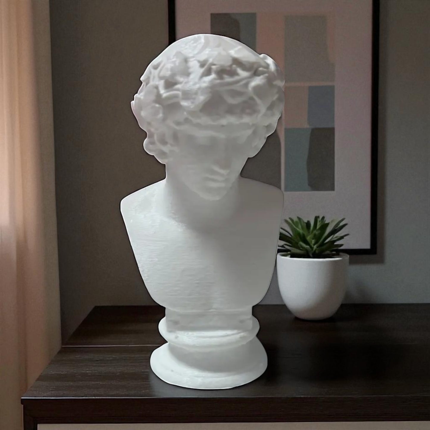 a detailed bust of michelangelo’s david, capturing the timeless elegance and strength of this classical masterpiece. this sculpture adds an artistic and sophisticated touch to any decor, embodying the iconic beauty of renaissance art