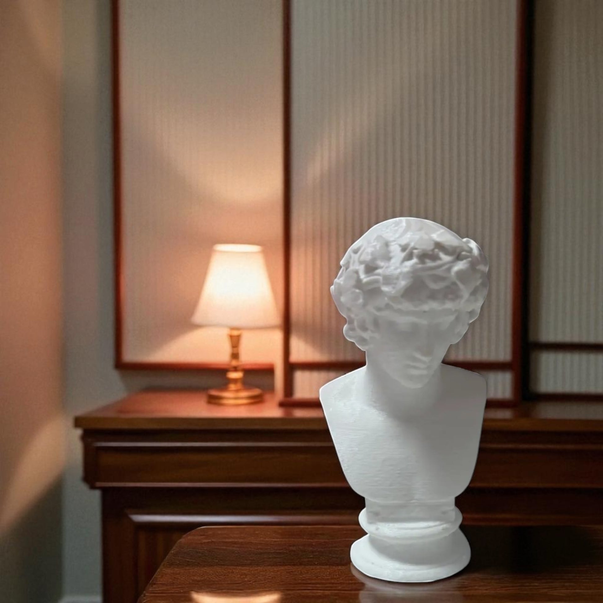 A detailed bust of Michelangelo’s David, capturing the timeless elegance and strength of this classical masterpiece. This sculpture adds an artistic and sophisticated touch to any decor, embodying the iconic beauty of Renaissance art