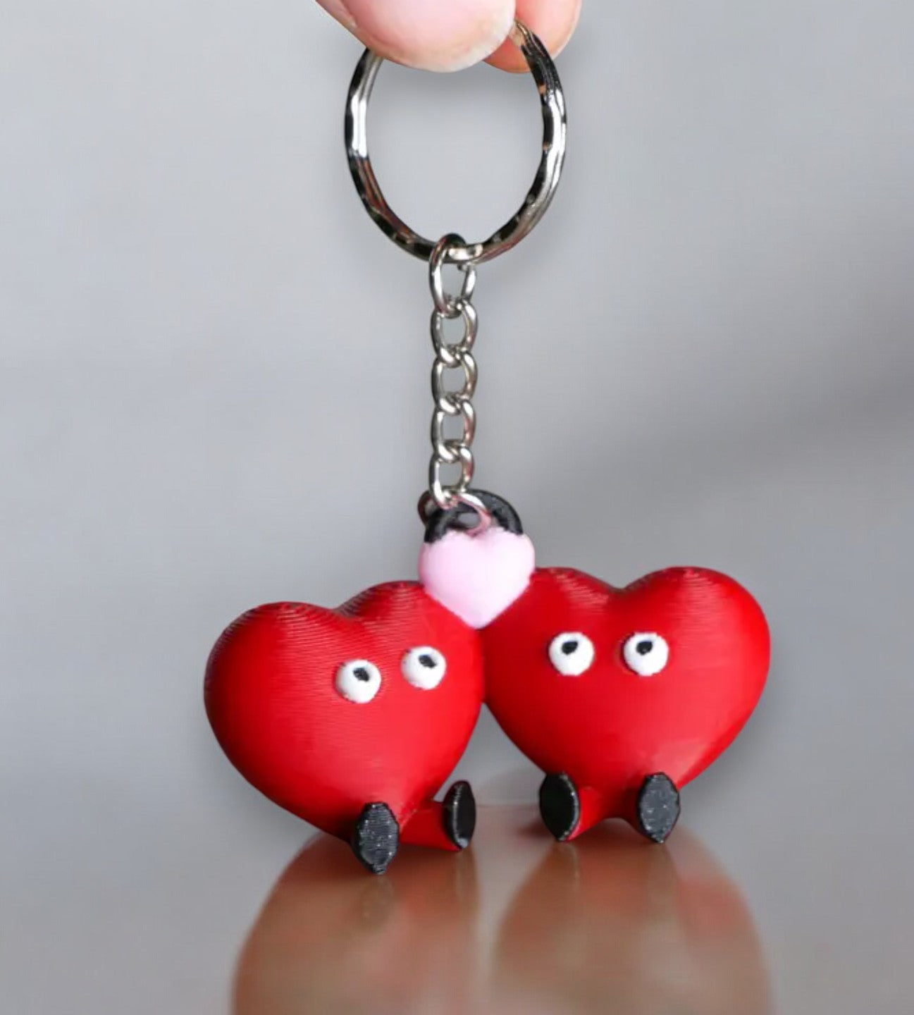 couples keychain with two hearts, feet, and eyes