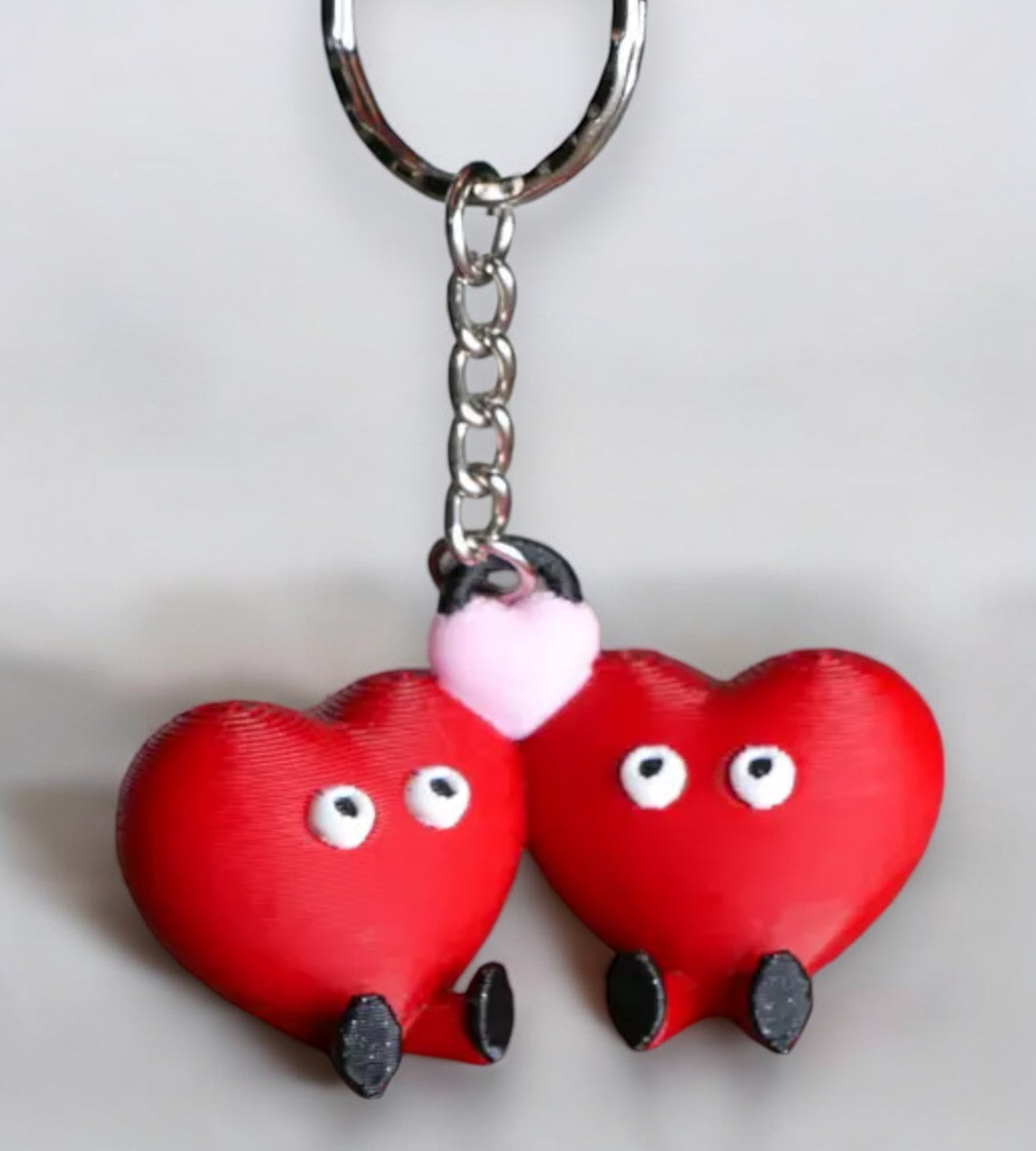 couples keychain with two hearts, feet, and eyes