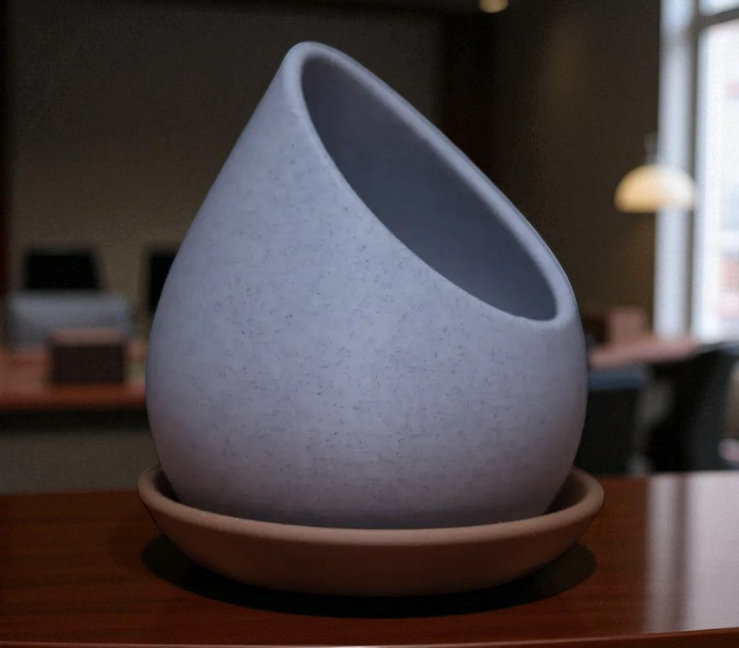 Raindrop Planter a stylish planter pot designed in the elegant shape of a raindrop, perfect for adding a modern and natural touch to your indoor or outdoor gardening