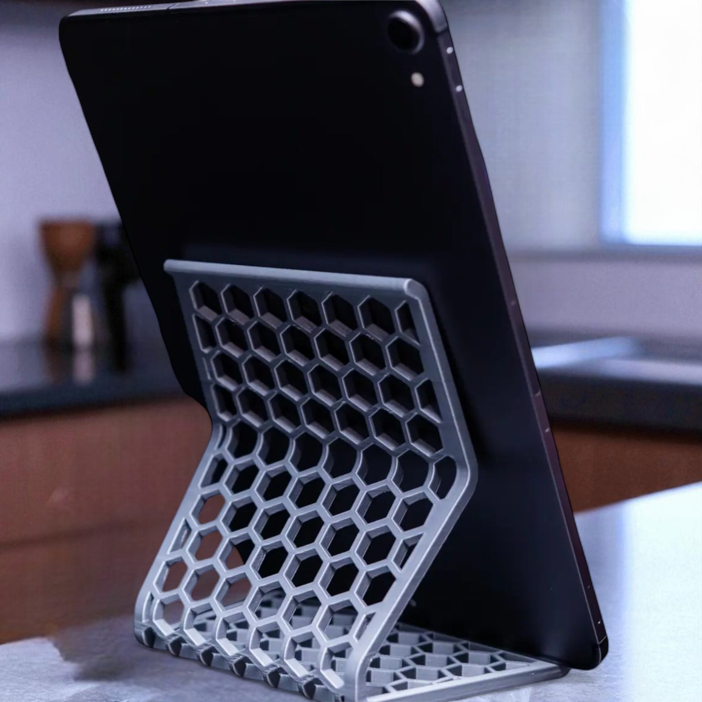honeycomb stand: a versatile and stylish stand with a honeycomb pattern, designed to hold phones, tablets, and kindles securely at an optimal viewing angle, blending functionality with modern design.