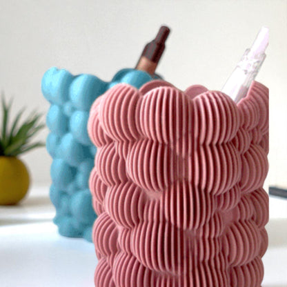 Bubbley Solid and Bubbley Lamel holders, versatile and stylish makeup brush or pen organizers with a playful bubble design, ideal for adding charm to office desks or vanity setups.