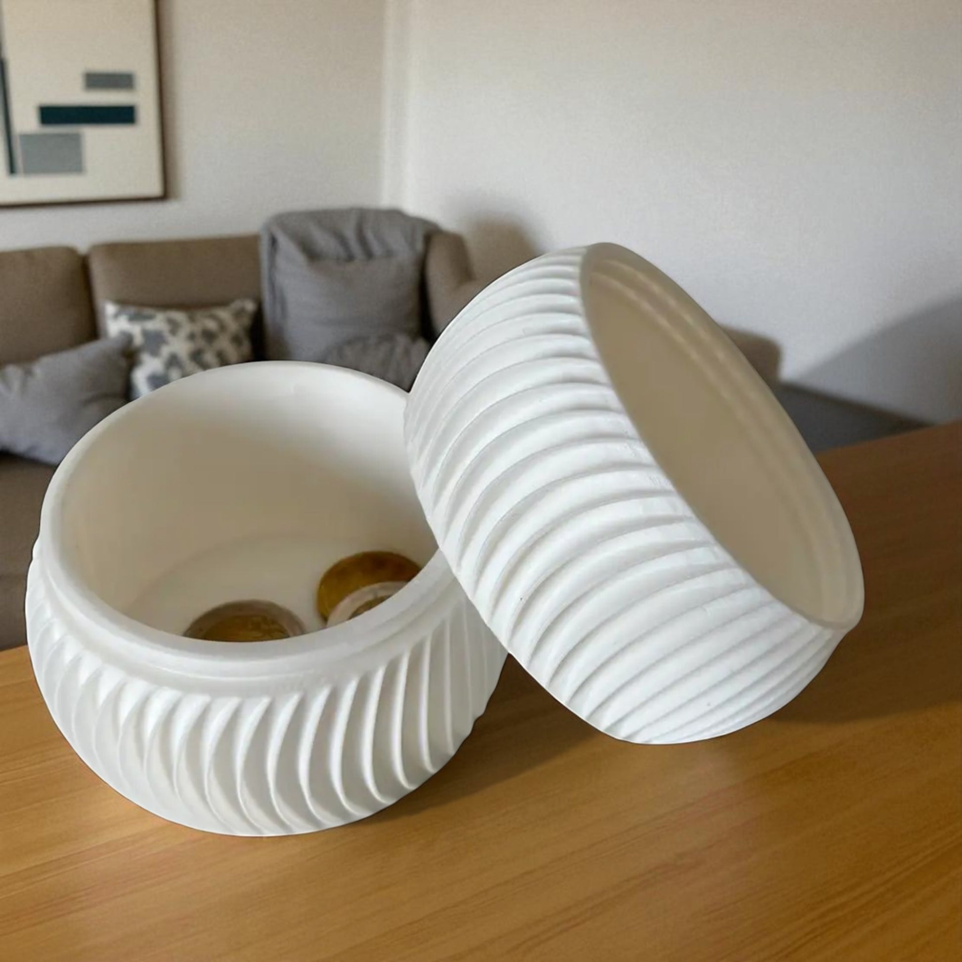  luxury coin bank designed to turn saving into a sophisticated experience. Available in two different sizes, this stylish coin bank seamlessly blends form and function, making it the perfect addition to any home or office. 