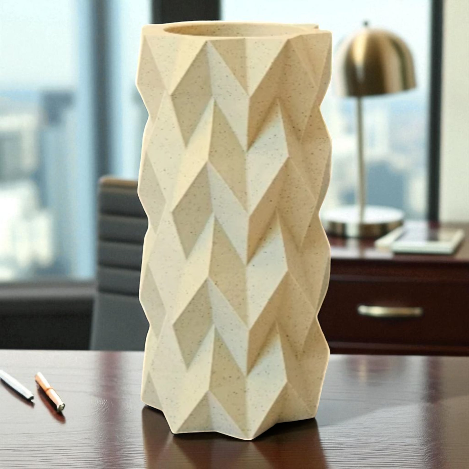 A modern 3D-printed vase with a sleek, sculptural design. Made from durable, waterproof material, this stylish vase is perfect for fresh flowers, dried arrangements, or as a standalone decor piece. Ideal for contemporary and minimalist interiors.