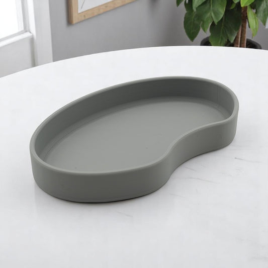 Set of two bean shaped desk organizers in different sizes for tidy and stylish storage.