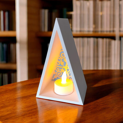 White triangular book stand with an intricate cut-out tree design, displayed on a white surface against a light grey background.