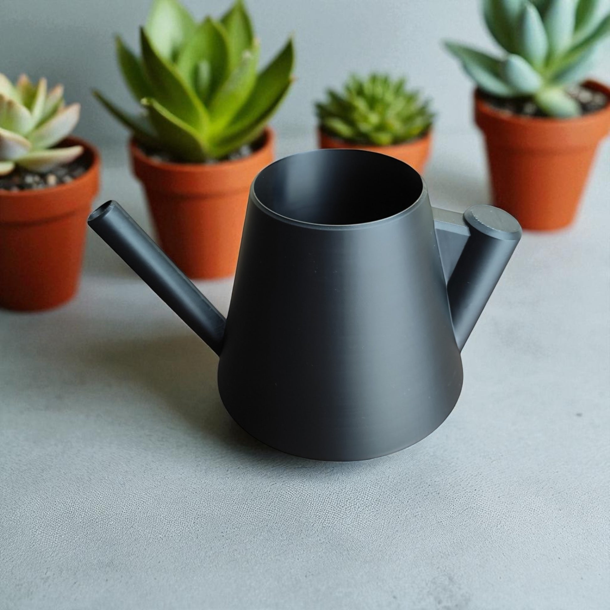 Modern stylish watering can with ergonomic handle – sleek design for indoor and outdoor plant care, perfect for precise and spill-free watering.