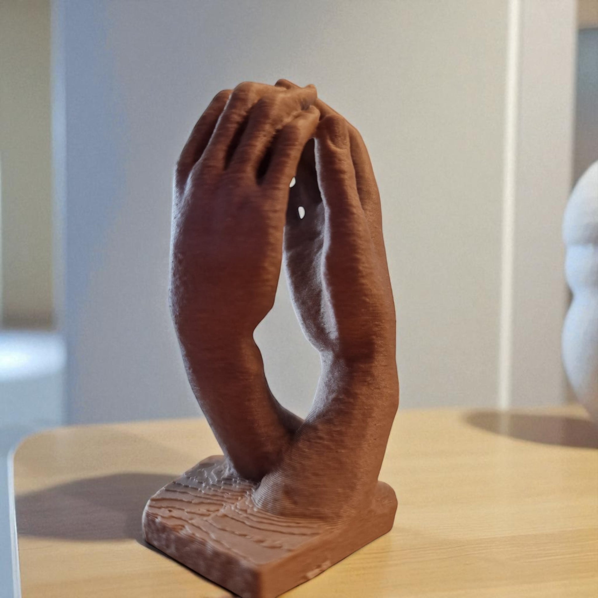  two elegantly crafted hands reaching out and touching, symbolizing connection, unity, and timeless bond. The design features  flowing curves that its artistic and modern aesthetic, making it a perfect decorative piece for any space.