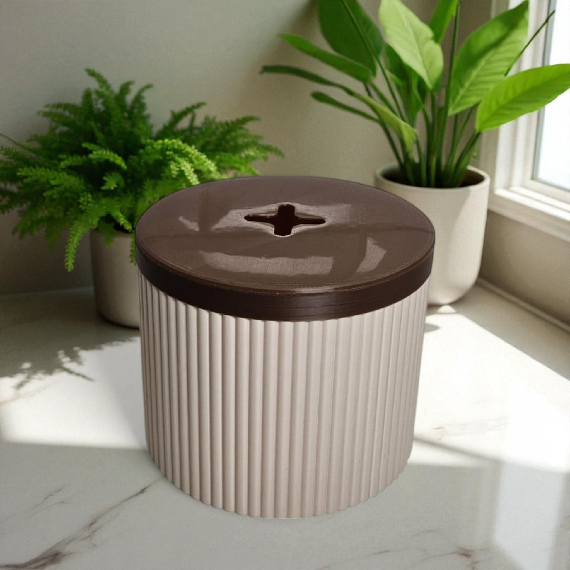 A stylish and practical toilet paper holder box designed to fit a whole roll, keeping it safe from kids and pets. Features a small opening for easy access while maintaining a clean and organized look.
