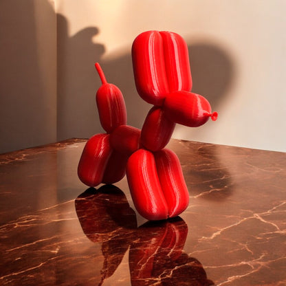 3D-printed figurine resembling a playful dog made from balloons, available in three different sizes. Perfect for home decor, kids' rooms, or as a unique gift for dog lovers.