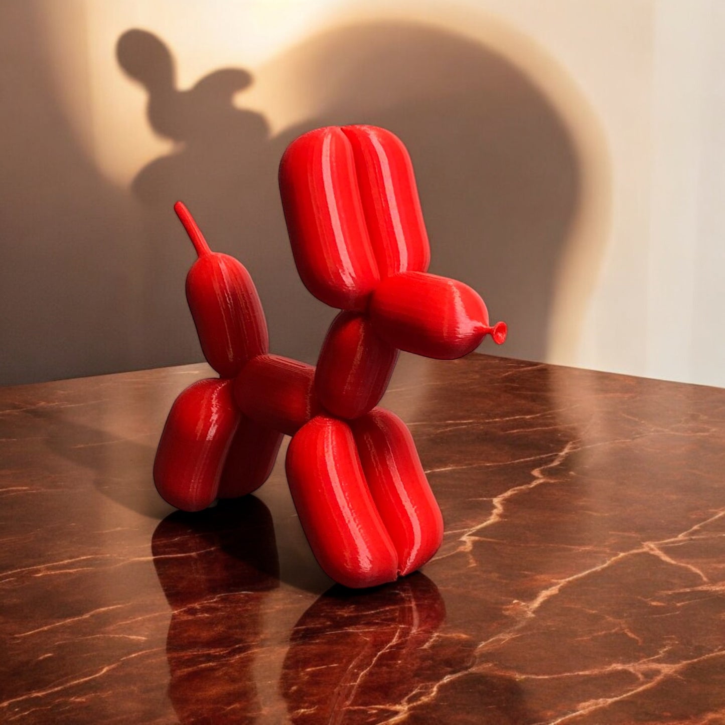 3d-printed figurine resembling a playful dog made from balloons, available in three different sizes. perfect for home decor, kids' rooms, or as a unique gift for dog lovers.