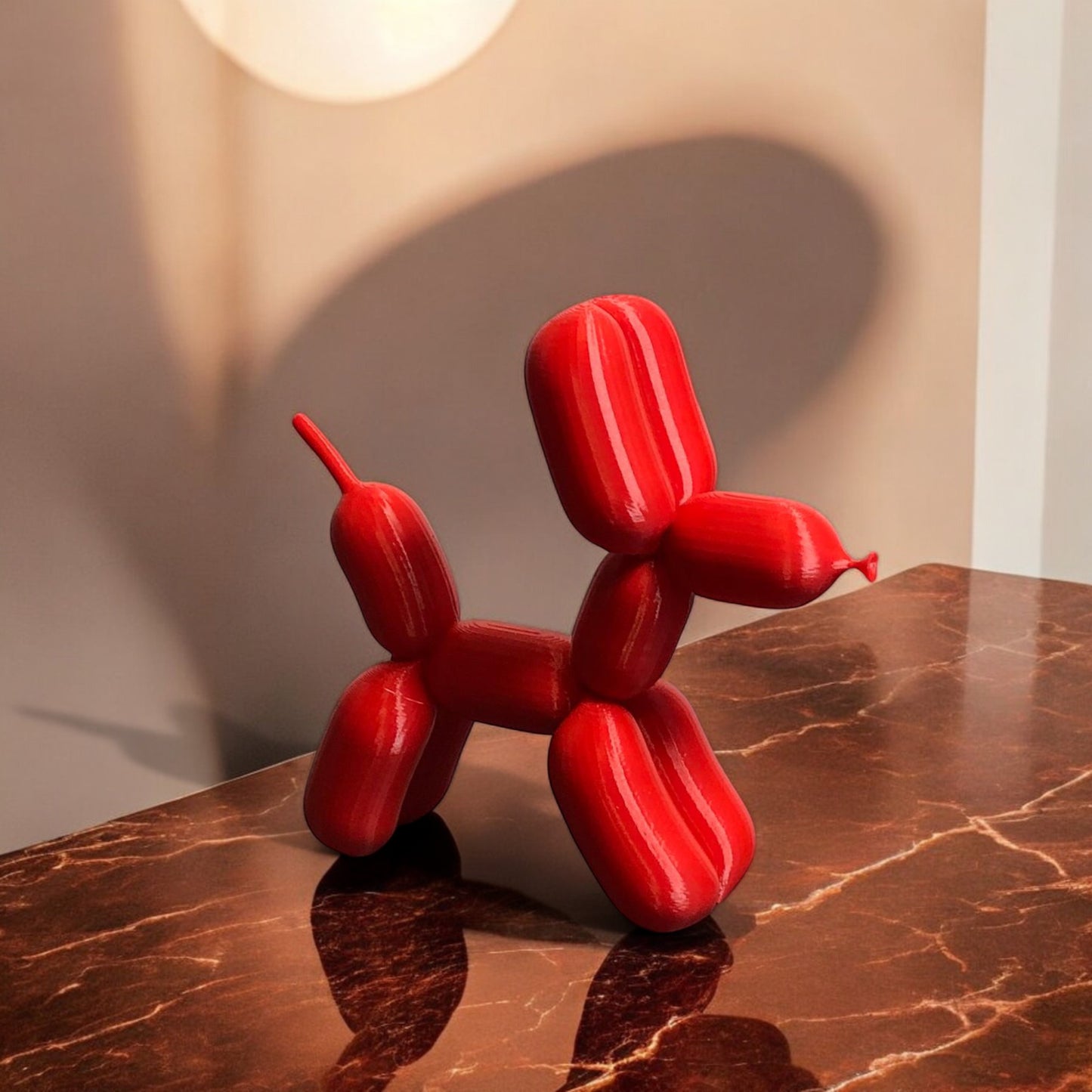 3d-printed figurine resembling a playful dog made from balloons, available in three different sizes. perfect for home decor, kids' rooms, or as a unique gift for dog lovers.