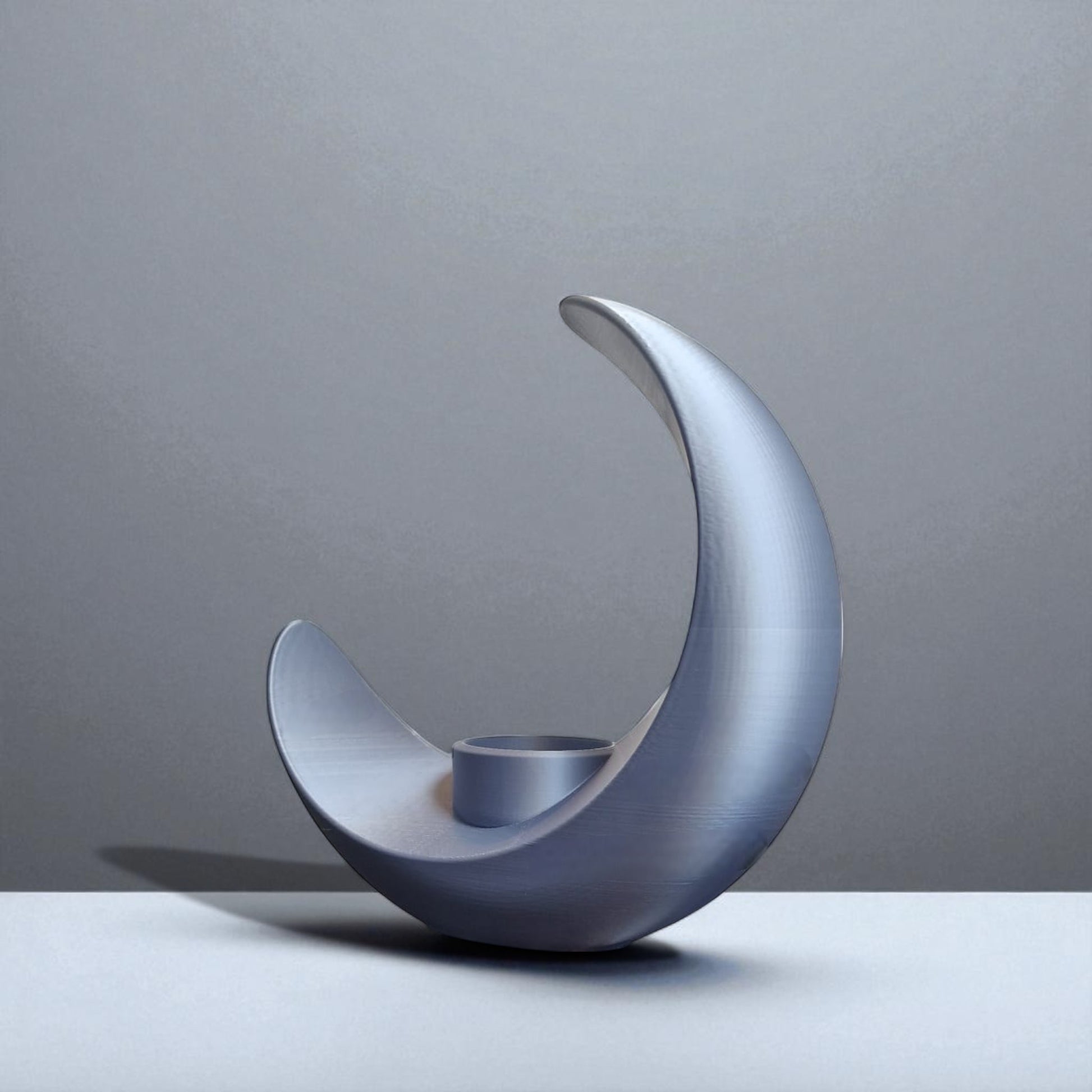 An elegant moon-inspired centerpiece with a celestial design, perfect for adding a touch of sophistication and romance to any space. This stunning decor piece captures the serene beauty of the moon, making it an ideal statement for tables, shelves, or special occasions.