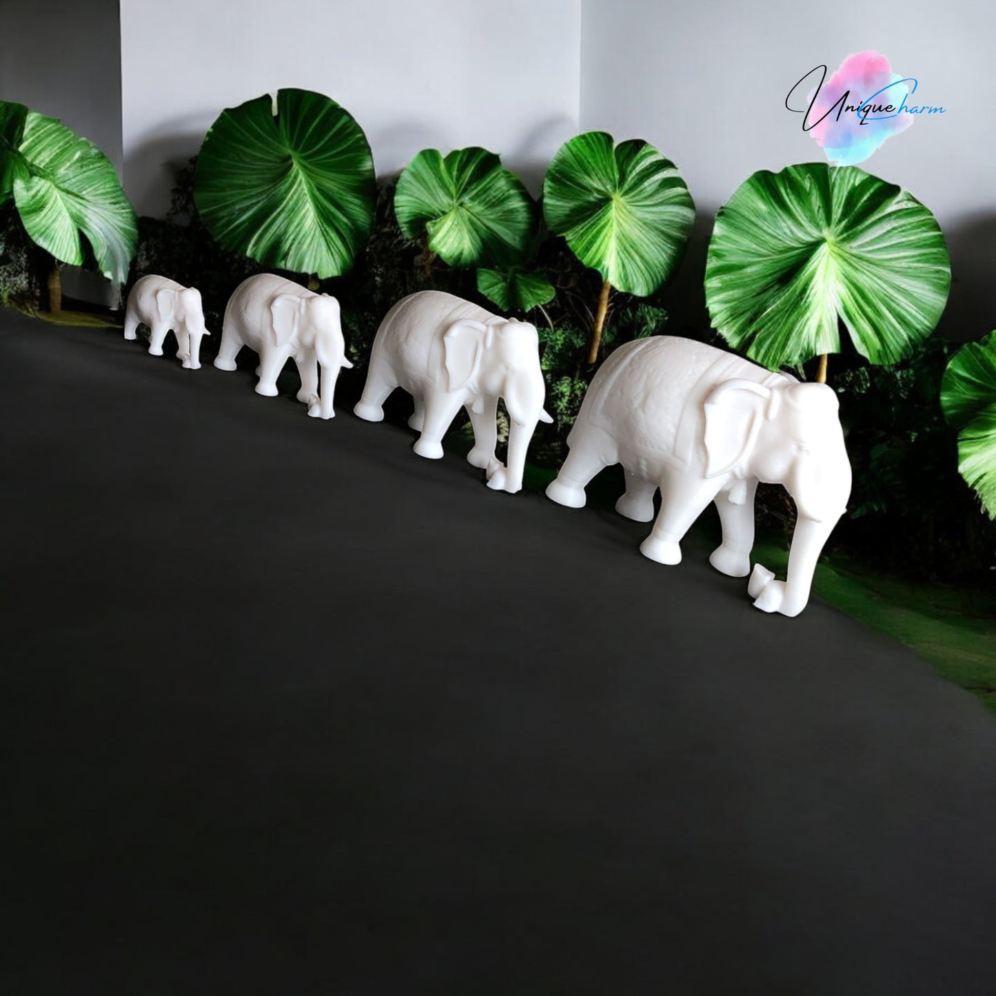 set of 4 indian elephant figurines in varying sizes, 3d-printed with intricate details. modern and elegant home decor piece, perfect for shelves, desks, and gifting. symbolizing wisdom, luck, and prosperity, these minimalist elephant sculptures add a spiritual and stylish touch to any space.