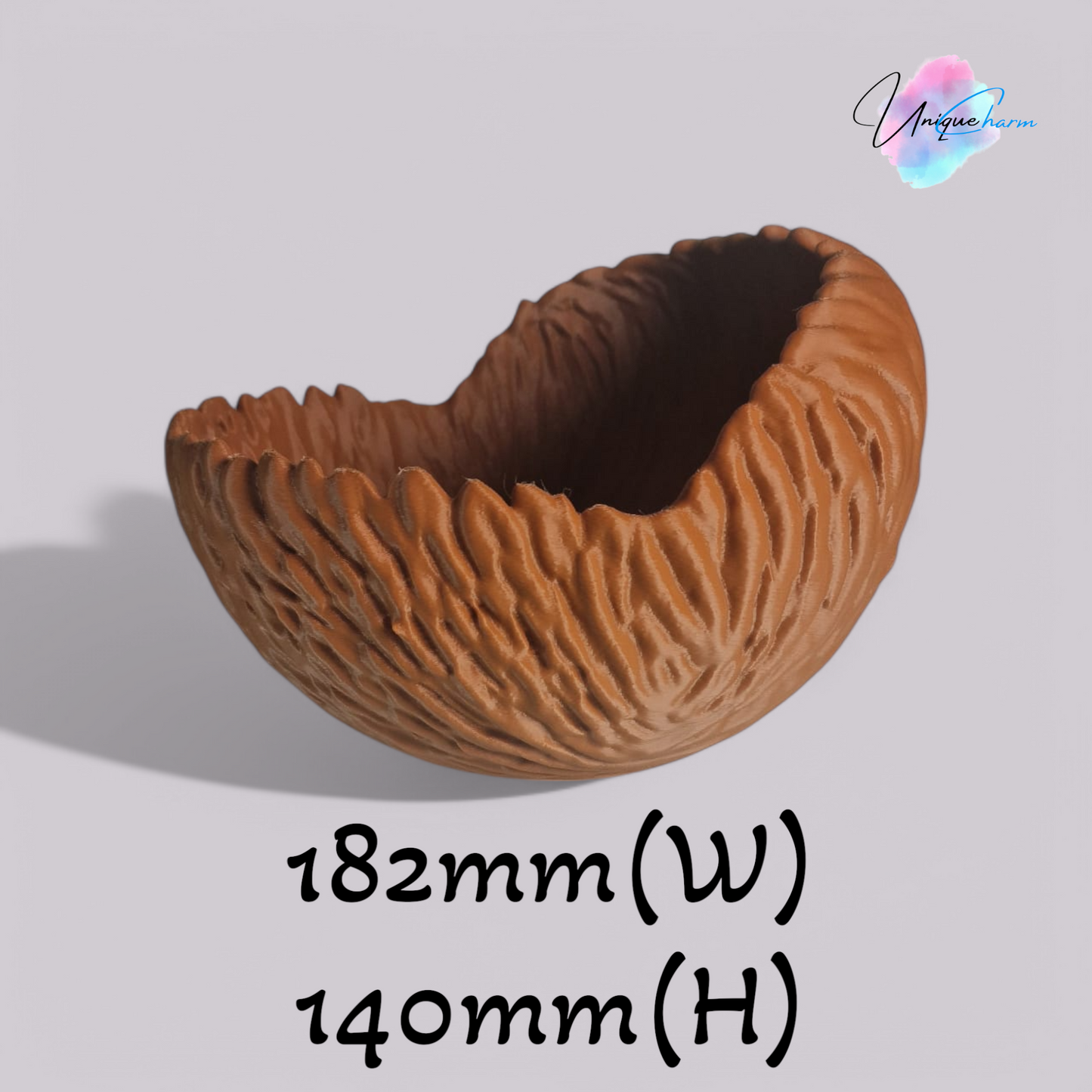 a beautifully designed walnut-shaped bowl resembling a quarter of a walnut shell, perfect as a key tray, candy dish, or nut bowl. features a rustic, nature-inspired design with a smooth finish, making it a stylish and functional home décor piece.