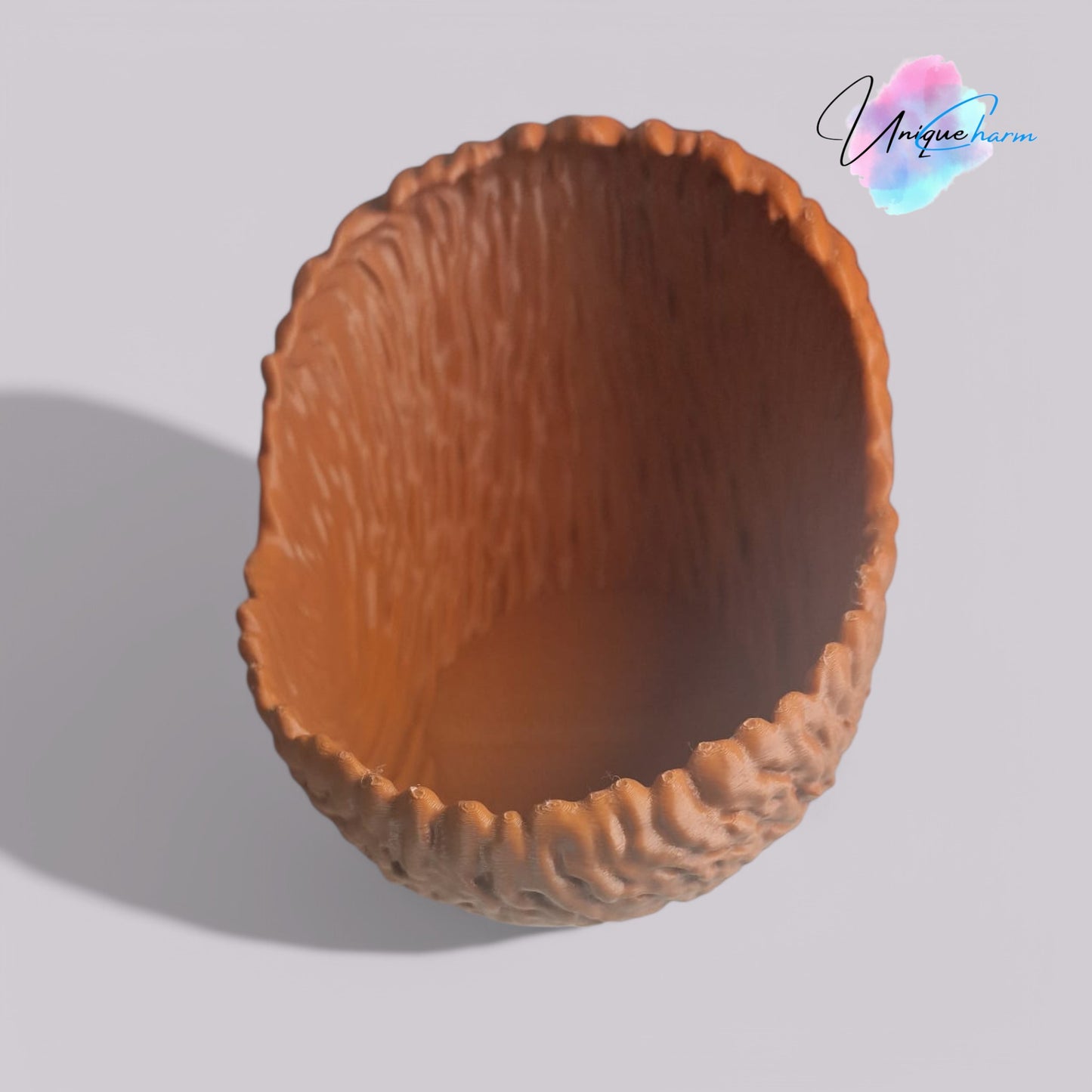 a beautifully designed walnut-shaped bowl resembling a quarter of a walnut shell, perfect as a key tray, candy dish, or nut bowl. features a rustic, nature-inspired design with a smooth finish, making it a stylish and functional home décor piece.