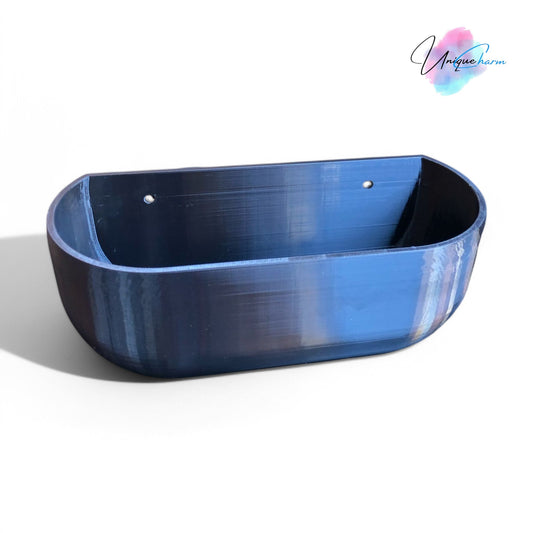 Modern rectangular wall planter with rounded corners, mounted on a wall and planted with fresh herbs like parsley, coriander, and basil. The large 3D printed planter is shown in use indoors, highlighting its sleek design and easy wall-mount installation with screws or tape