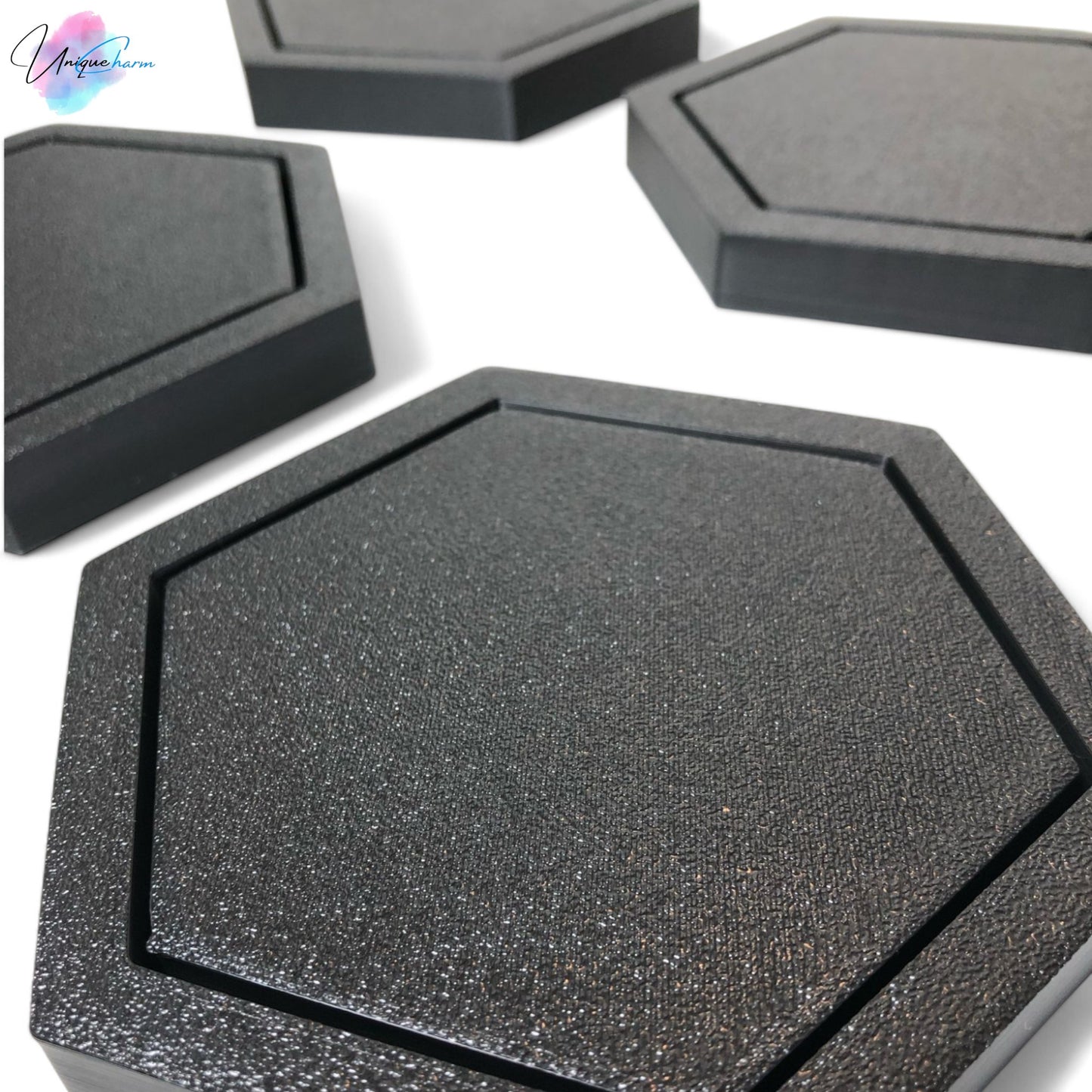 modern hexagonal coaster in a minimalist design, measuring 115mm x 14mm, perfect for protecting surfaces from hot drinks. available as a single piece, set of 4, or set of 6. durable and stylish home decor accessory