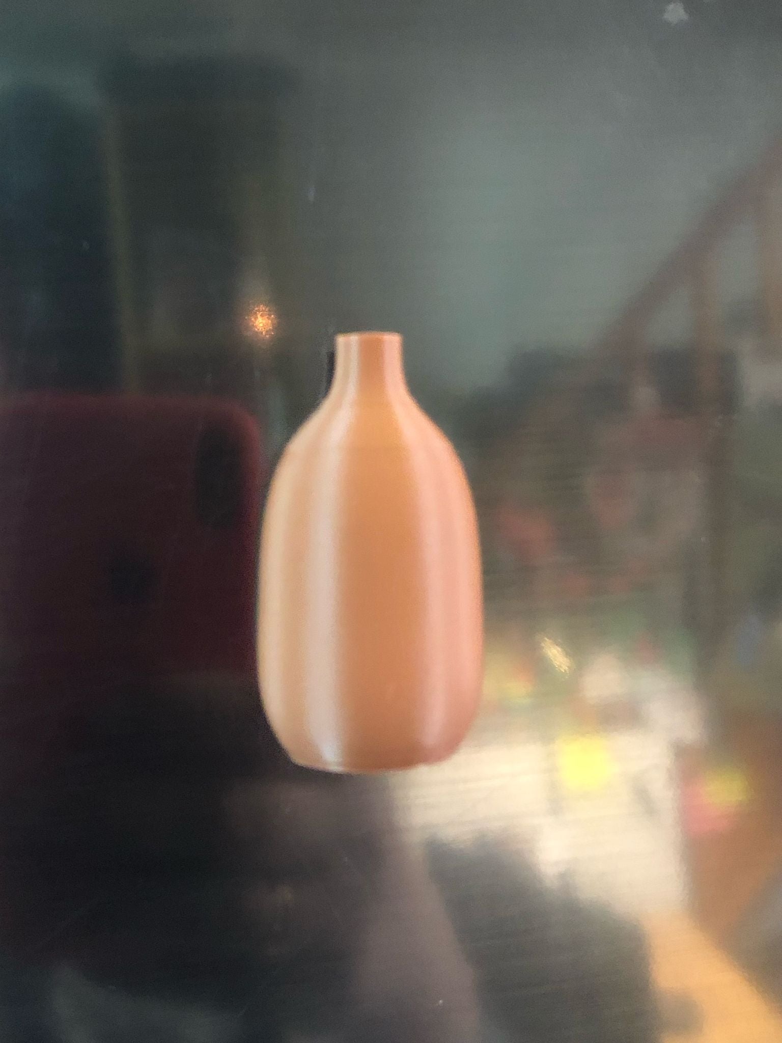 Set of 5 small magnetic mini vases in random earthy brown tones, 3D printed with a modern design, displayed on a fridge holding tiny flowers.

