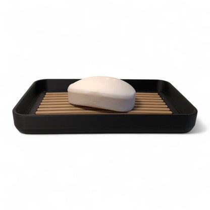 Modern soap tray with raised drainage support, shown holding a soap bar and pump bottle, perfect for bathroom organization and keeping soap dry

