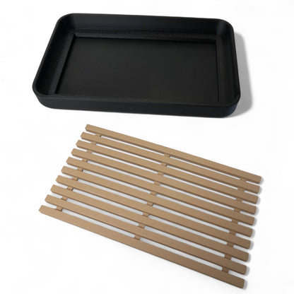 Modern soap tray with raised drainage support, shown holding a soap bar and pump bottle, perfect for bathroom organization and keeping soap dry

