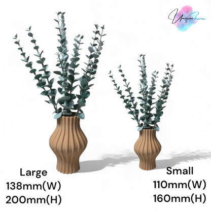 Modern 3D printed sculptural vase with wavy vertical grooves, shown in matte beige color on a white background – minimalist Nordic home decor centerpiece.
