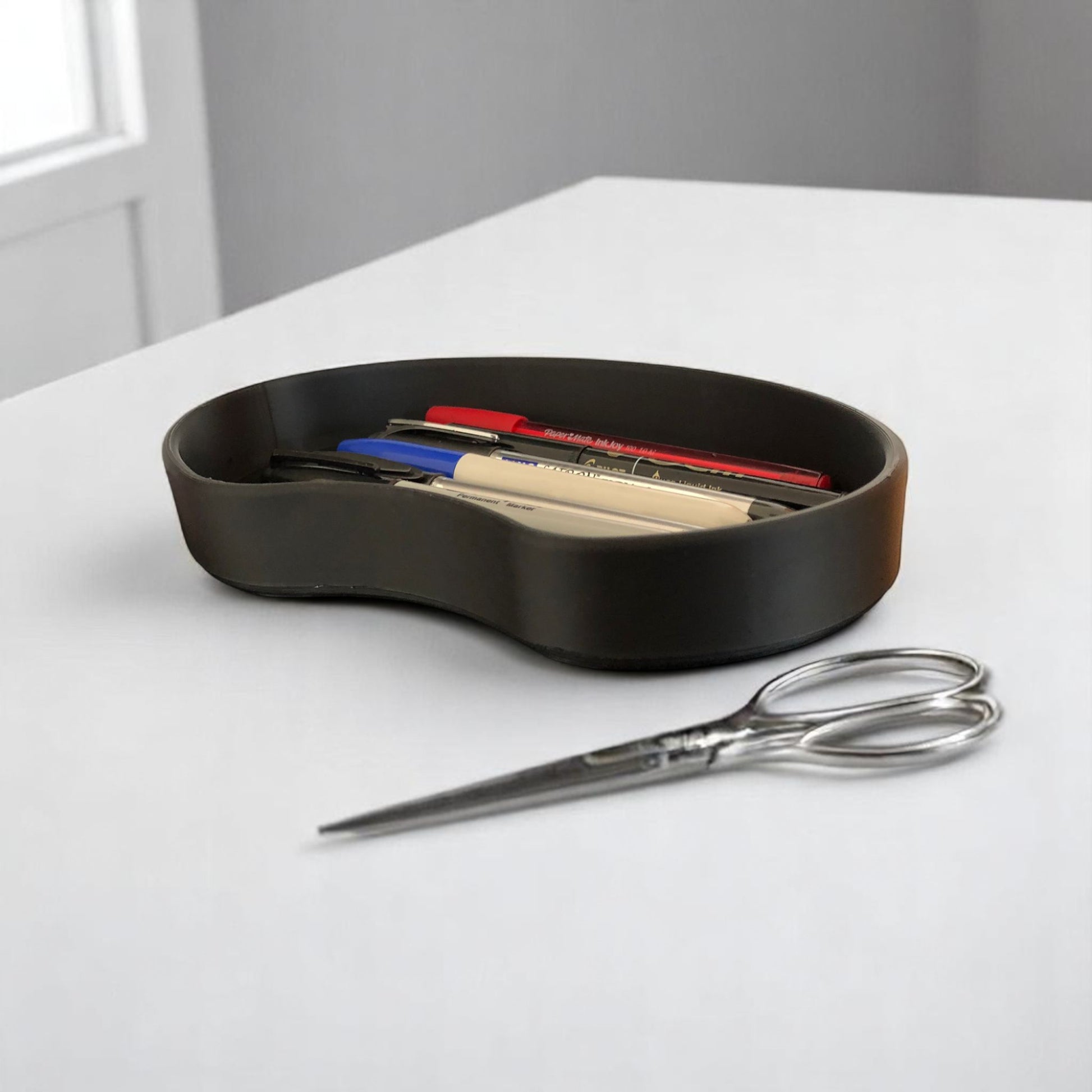 Set of two bean shaped desk organizers in different sizes for tidy and stylish storage.