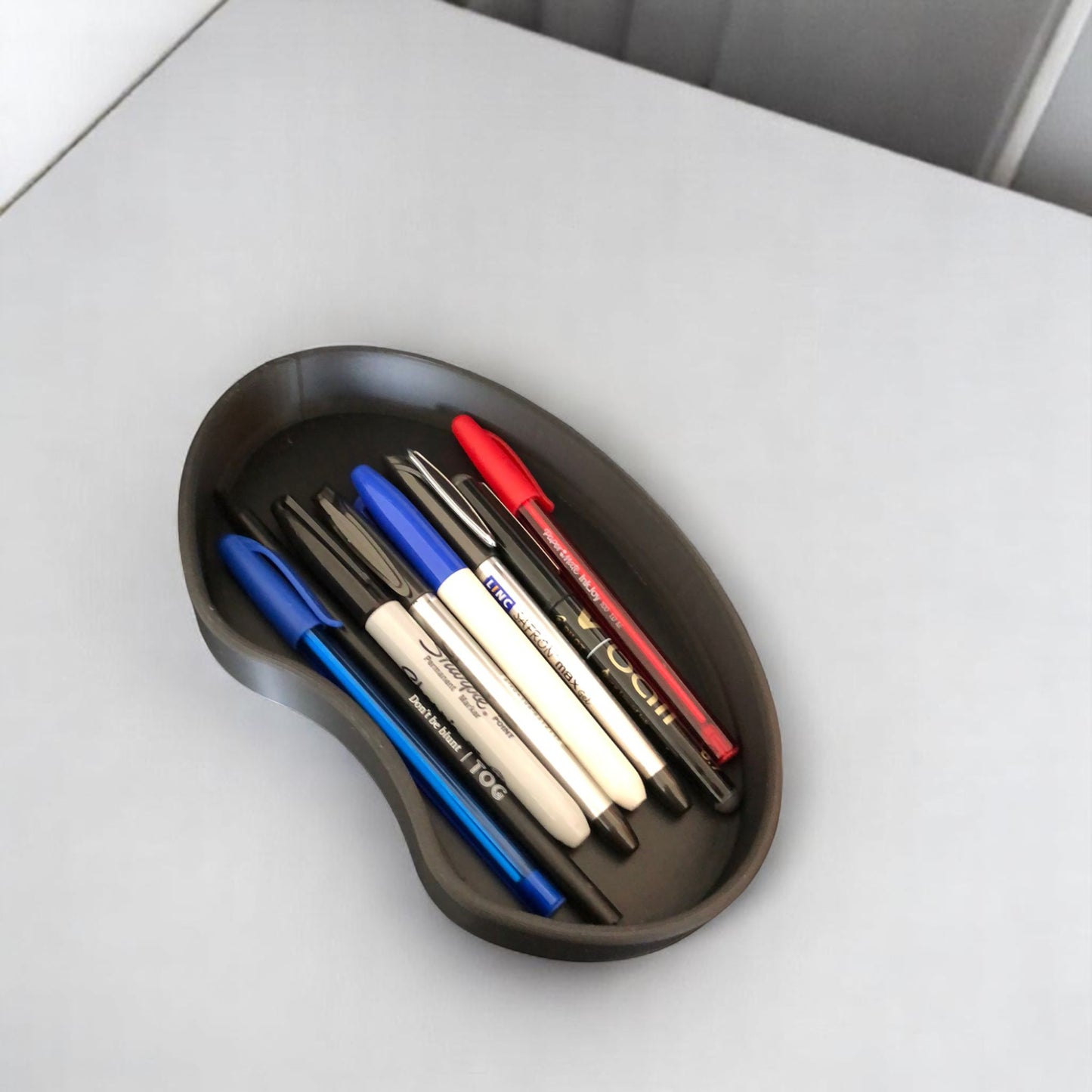set of two bean shaped desk organizers in different sizes for tidy and stylish storage.