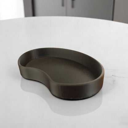 Set of two bean shaped desk organizers in different sizes for tidy and stylish storage.