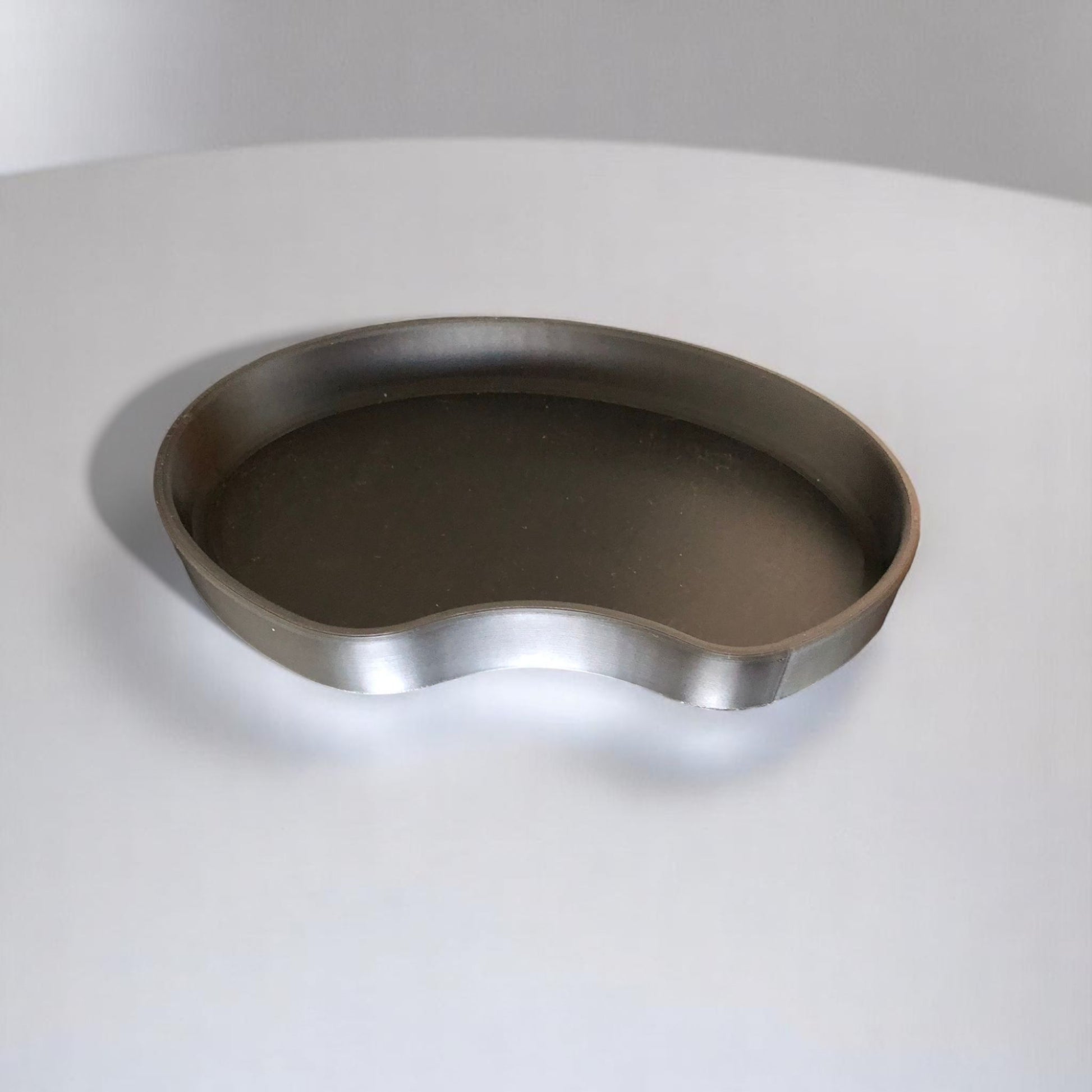 Set of two bean shaped desk organizers in different sizes for tidy and stylish storage.