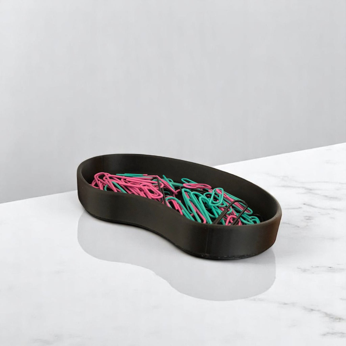 set of two bean shaped desk organizers in different sizes for tidy and stylish storage.