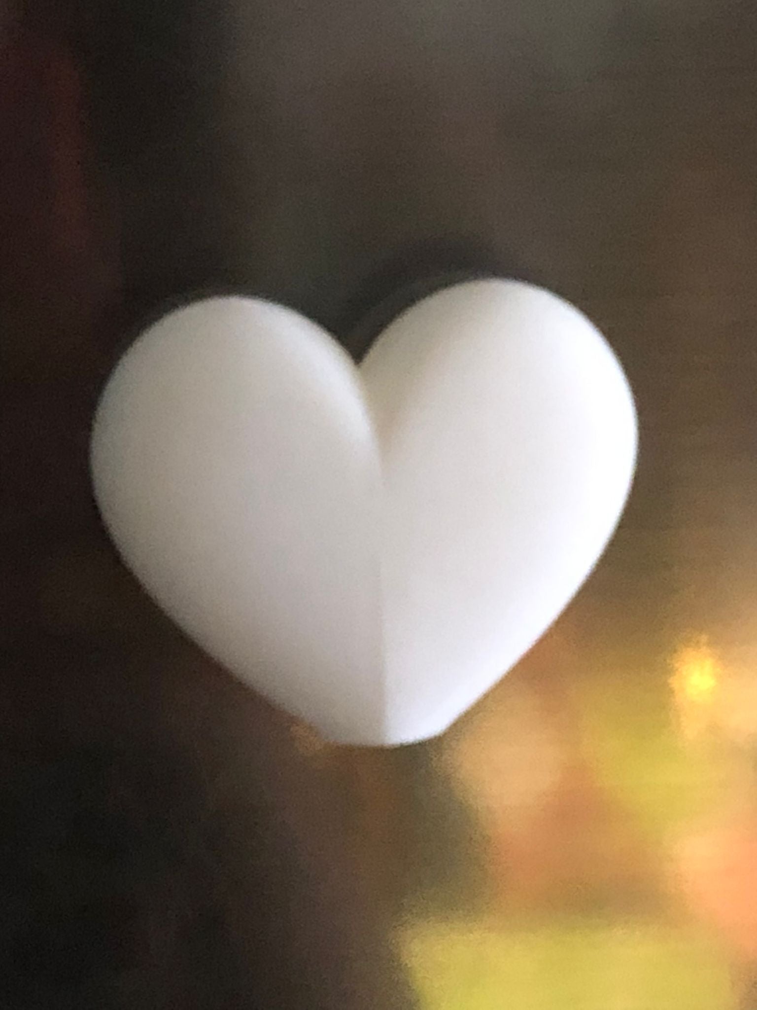 Set of mini magnetic vases in heart, star, diamond, and teardrop shapes, attached to a refrigerator and holding small colorful flowers, displayed in red and white colors.