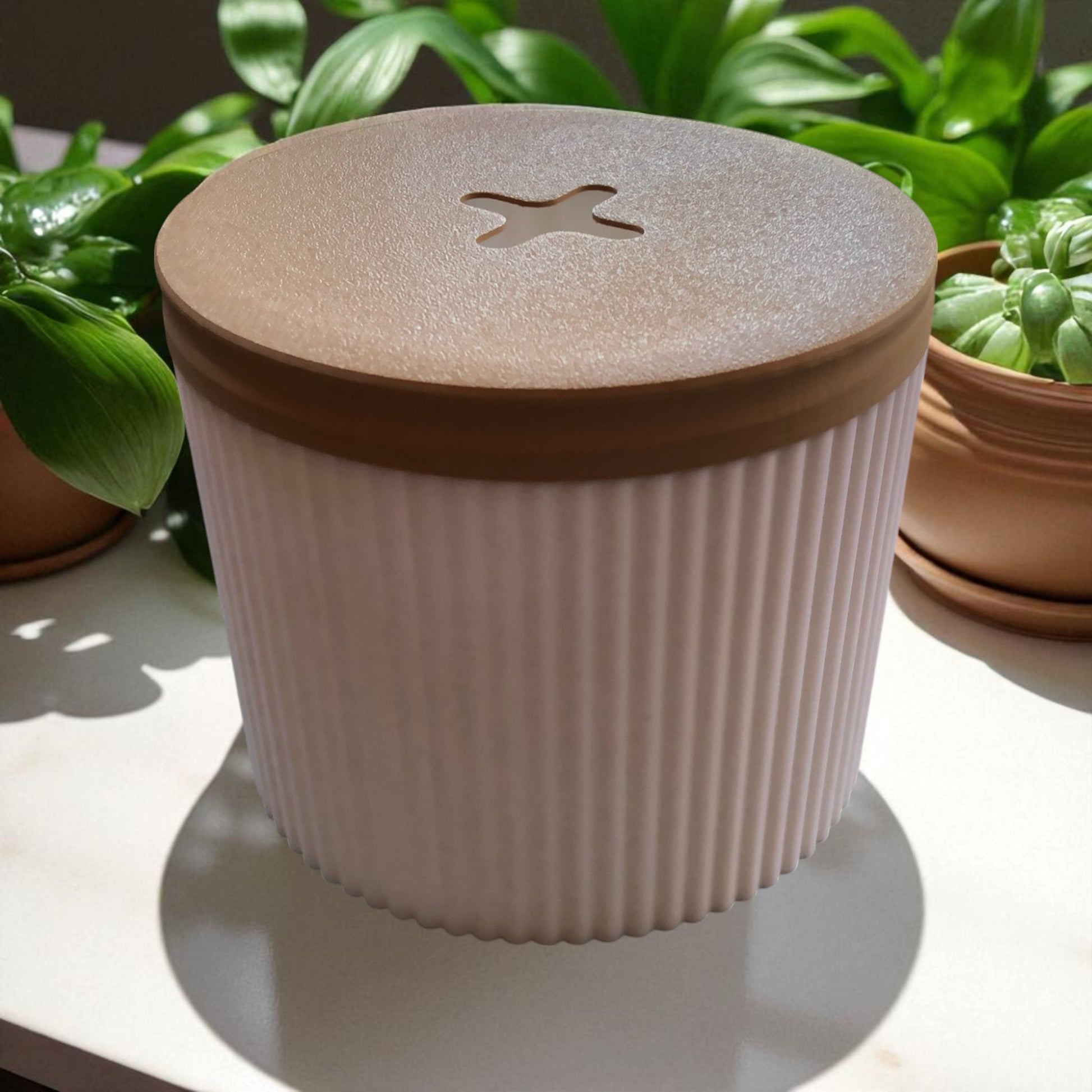 A stylish and practical toilet paper holder box designed to fit a whole roll, keeping it safe from kids and pets. Features a small opening for easy access while maintaining a clean and organized look.