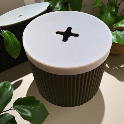 A stylish and practical toilet paper holder box designed to fit a whole roll, keeping it safe from kids and pets. Features a small opening for easy access while maintaining a clean and organized look.