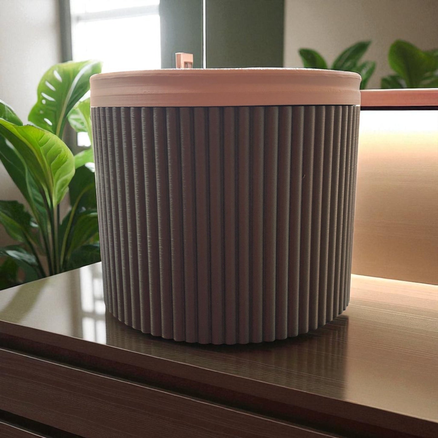 a stylish and practical toilet paper holder box designed to fit a whole roll, keeping it safe from kids and pets. features a small opening for easy access while maintaining a clean and organized look.
