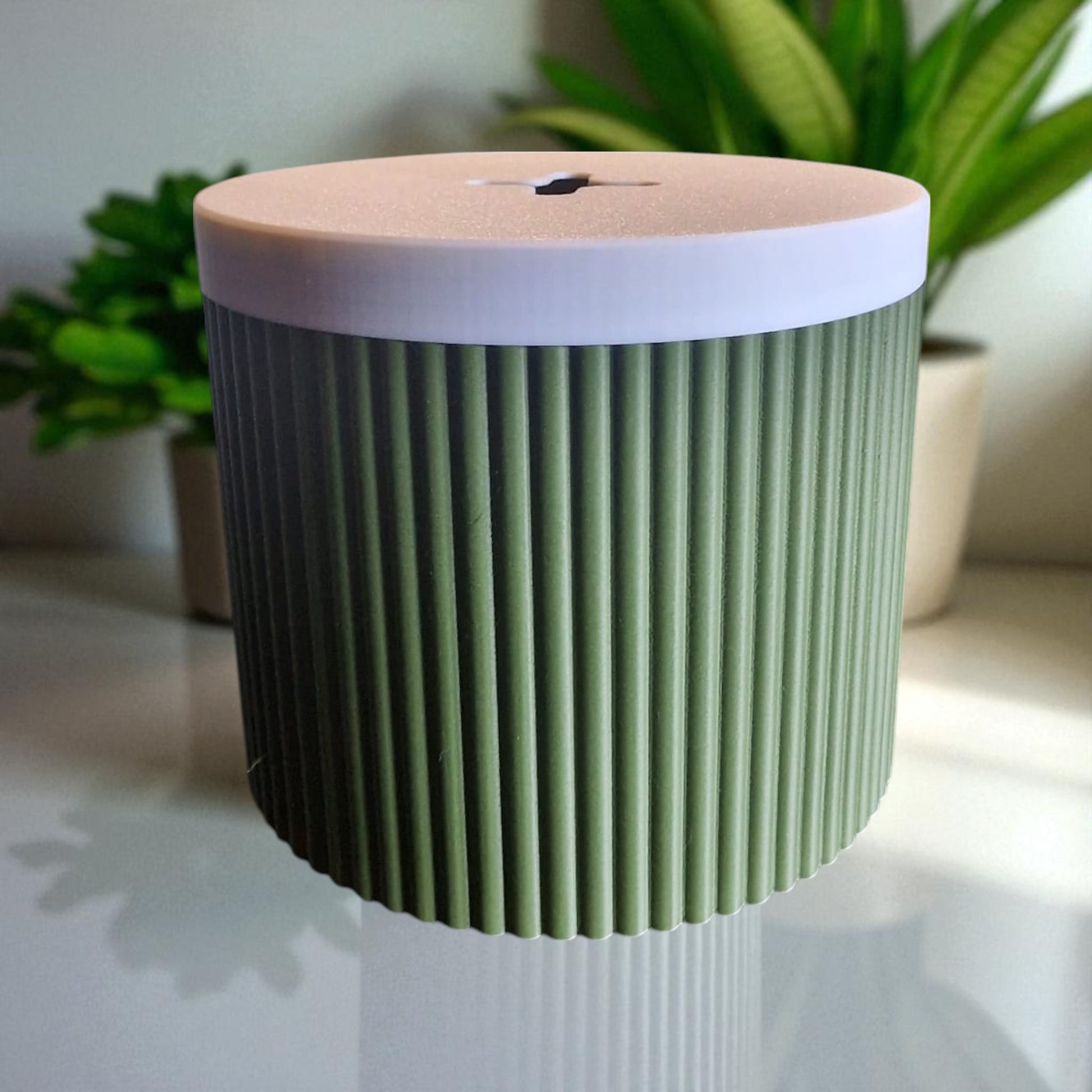 A stylish and practical toilet paper holder box designed to fit a whole roll, keeping it safe from kids and pets. Features a small opening for easy access while maintaining a clean and organized look.