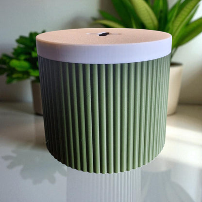 A stylish and practical toilet paper holder box designed to fit a whole roll, keeping it safe from kids and pets. Features a small opening for easy access while maintaining a clean and organized look.