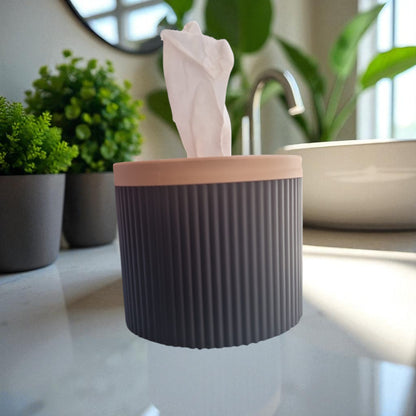 A stylish and practical toilet paper holder box designed to fit a whole roll, keeping it safe from kids and pets. Features a small opening for easy access while maintaining a clean and organized look.
