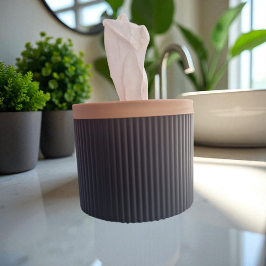 A stylish and practical toilet paper holder box designed to fit a whole roll, keeping it safe from kids and pets. Features a small opening for easy access while maintaining a clean and organized look.