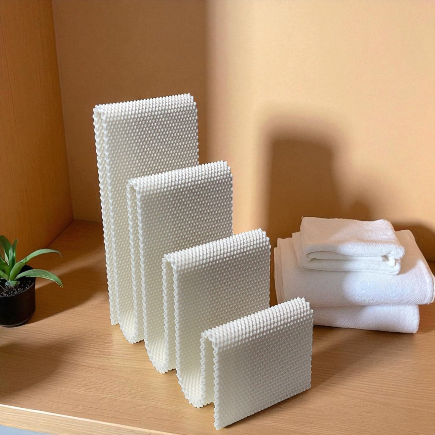 modern wavy book stand in textured white, holding two books upright; perfect for organizing books, magazines, or vinyls on a desk, shelf, or reading nook