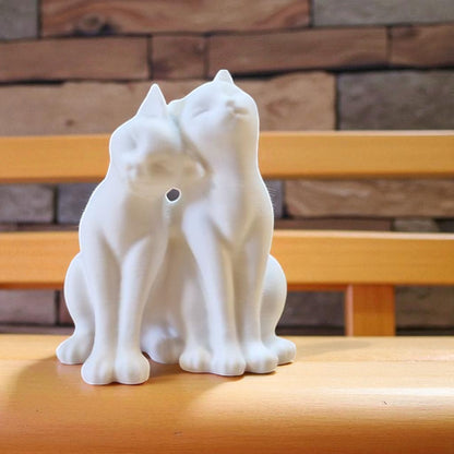 A heartwarming statue of two cats, symbolizing love and companionship between animals. Perfect for cat lovers and a charming addition to any home decor.